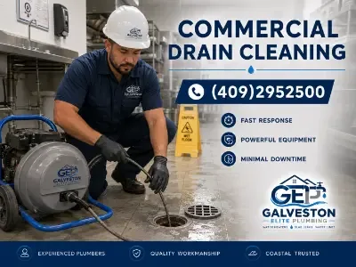 Plumber performing commercial drain cleaning in a kitchen using professional equipment