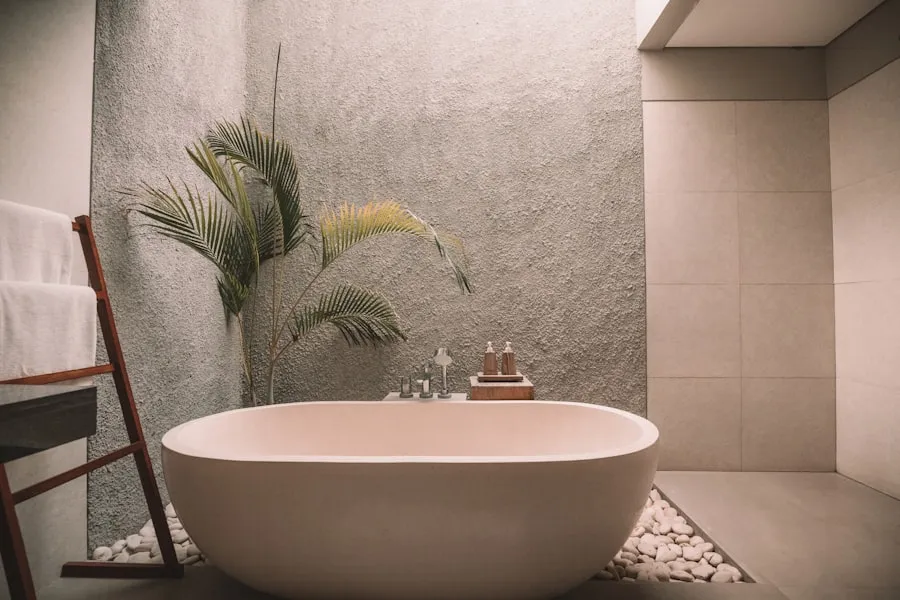 Freestanding bathtub with chrome faucet and hand shower installation